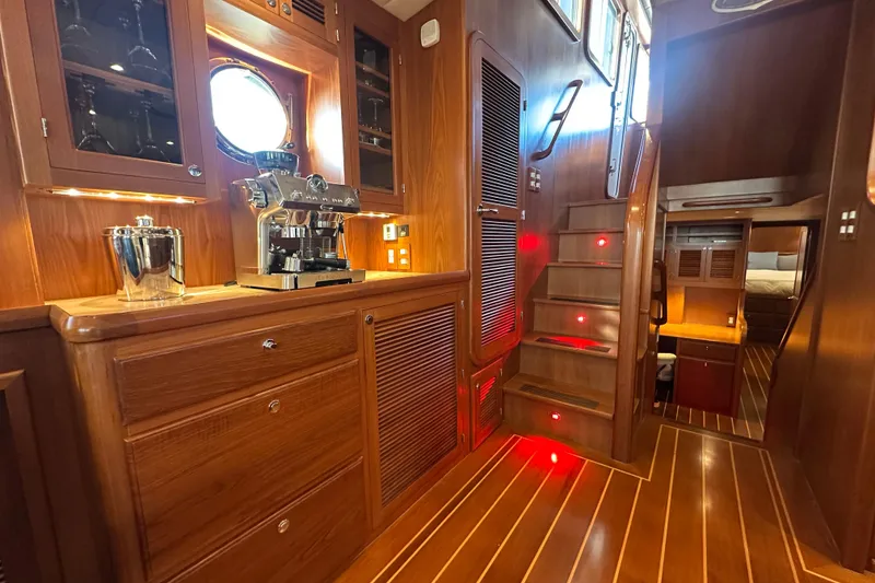 Slide: The Image of Luxurious 2017 Kadey-Krogen 58EB yacht interior with wooden cabinetry and espresso machine. - 22