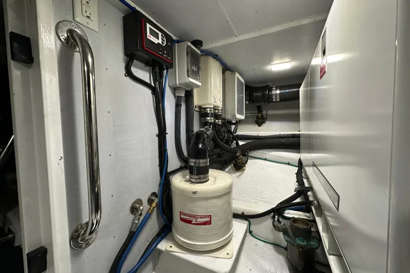 Slide: The Image of Engine room of 2017 Kadey-Krogen 58EB yacht with equipment and piping. - 95