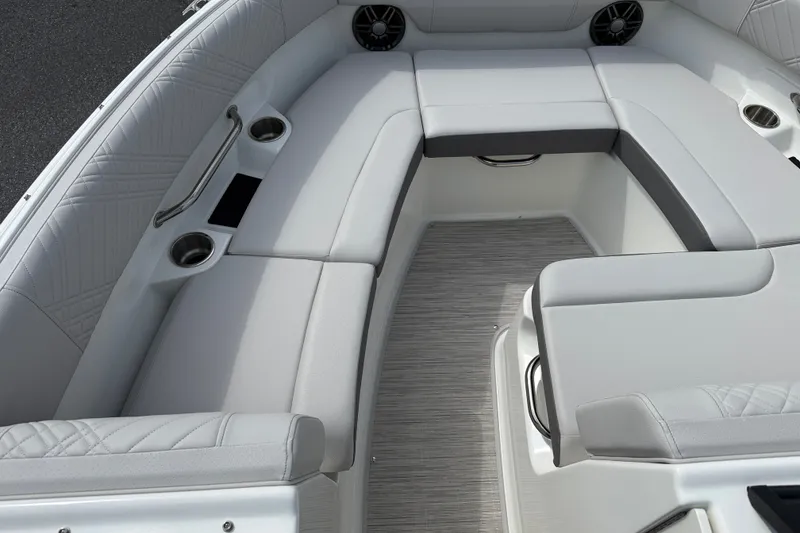 Slide: The Image of Luxurious seating area on 2026 Sea Ray SDX 230 boat with cup holders and speakers. - 9