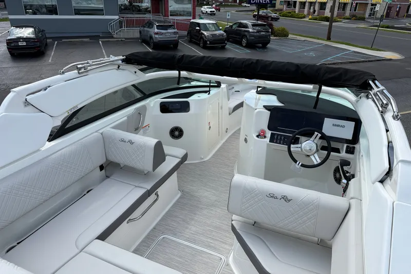 Slide: The Image of Interior view of 2026 Sea Ray SDX 230 boat, featuring luxurious seating and modern dashboard. - 10