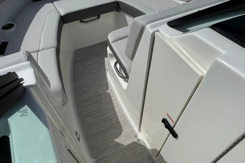 Slide: The Image of Interior view of 2026 Sea Ray SDX 230 boat, featuring sleek seating and modern design. - 8