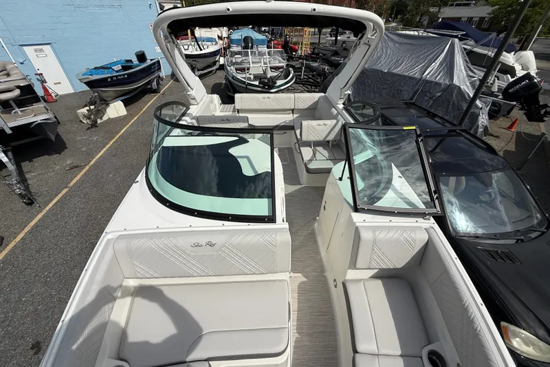 Slide: The Image of 2026 Sea Ray SDX 230 boat interior with spacious seating and modern design. - 5