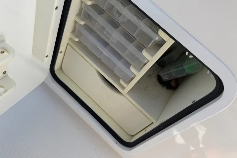 Slide: The Image of Storage compartment on 2019 Invincible 36 Open Fisherman boat with organized tackle boxes. - 35