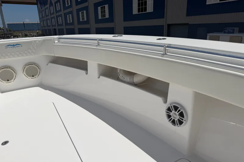 Slide: The Image of 2019 Invincible 36 Open Fisherman boat interior with speakers and storage compartments. - 26
