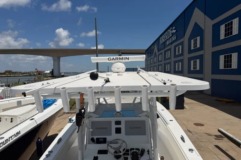 Slide: The Image of 2019 Invincible 36 Open Fisherman boat docked at marina with Garmin equipment. - 63