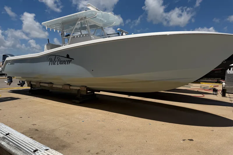 The Image of 2019 Invincible 36 Open Fisherman boat on dry dock under a clear blue sky. - 0