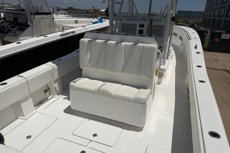 Slide: The Image of 2019 Invincible 36 Open Fisherman boat interior with white seating and console. - 12