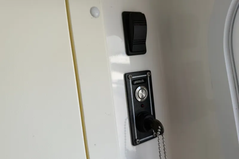 Slide: The Image of Control panel with switch and key on 2019 Invincible 36 Open Fisherman boat. - 46