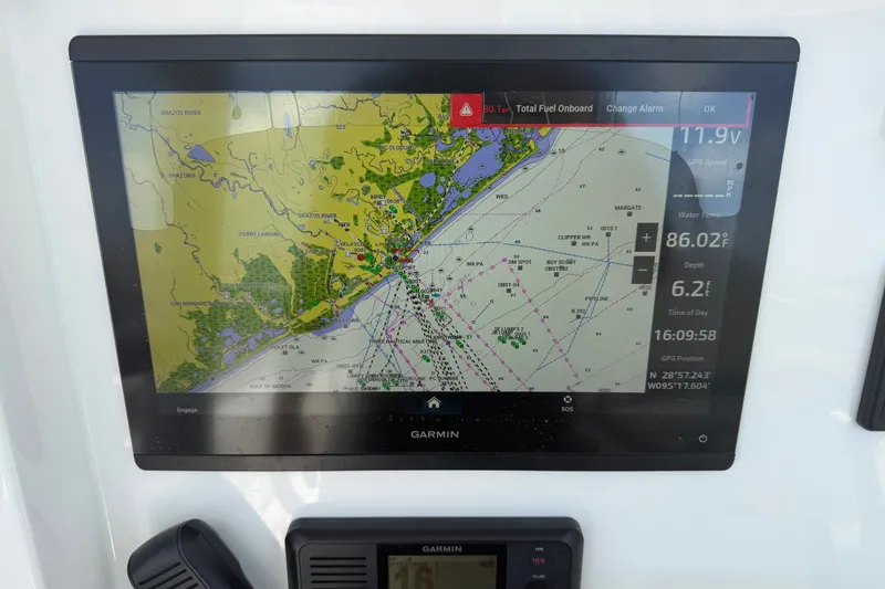 Slide: The Image of Garmin navigation display on 2019 Invincible 36 Open Fisherman boat, showing coastal map and data. - 52