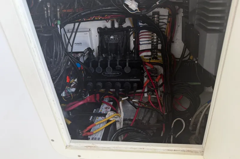 Slide: The Image of Electrical wiring and components inside a 2019 Invincible 36 Open Fisherman boat. - 43
