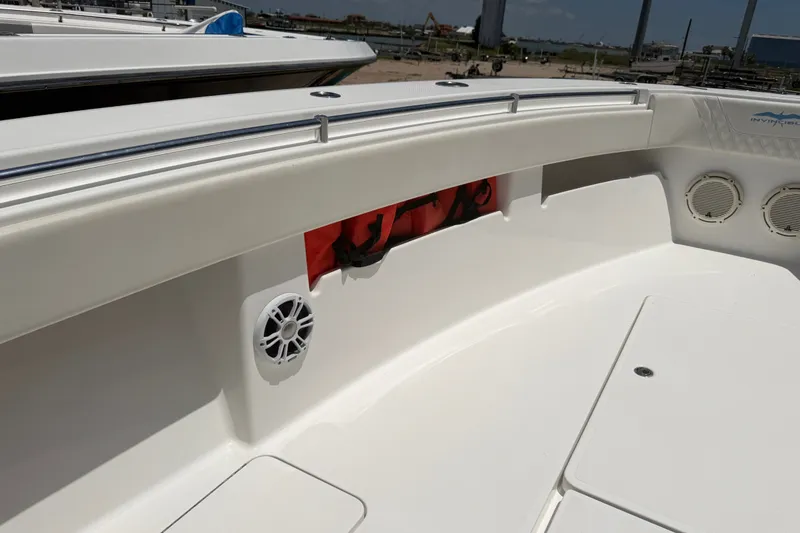 Slide: The Image of 2019 Invincible 36 Open Fisherman boat interior with speakers and storage compartment. - 27