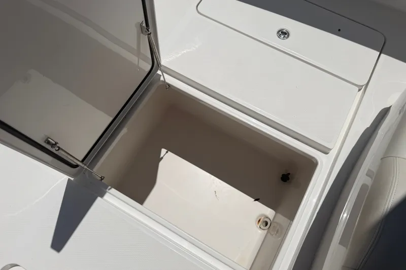 Slide: The Image of Open storage compartment on 2019 Invincible 36 Open Fisherman boat. - 29