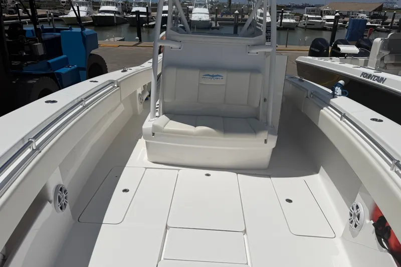 Slide: The Image of 2019 Invincible 36 Open Fisherman boat interior with seating and deck view. - 23