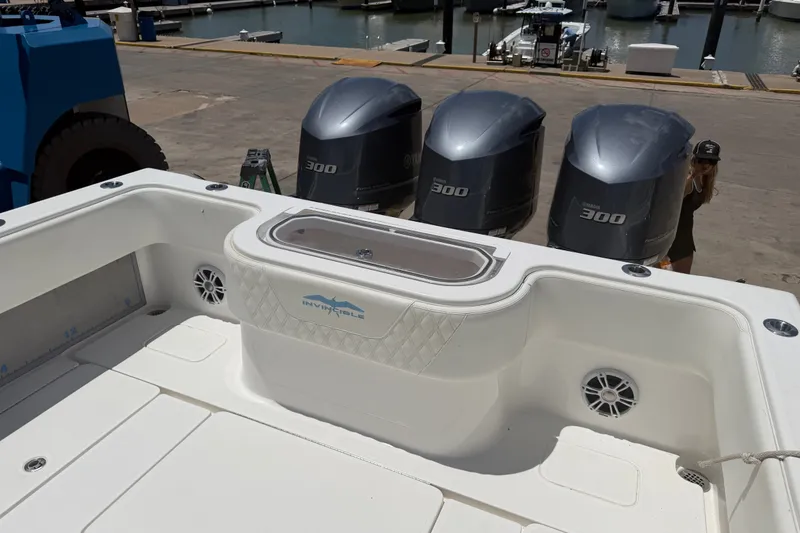 Slide: The Image of 2019 Invincible 36 Open Fisherman boat with triple Yamaha 300 engines at dock. - 15