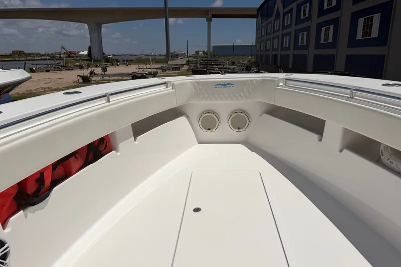 Slide: The Image of 2019 Invincible 36 Open Fisherman boat interior with speakers and storage compartments. - 22