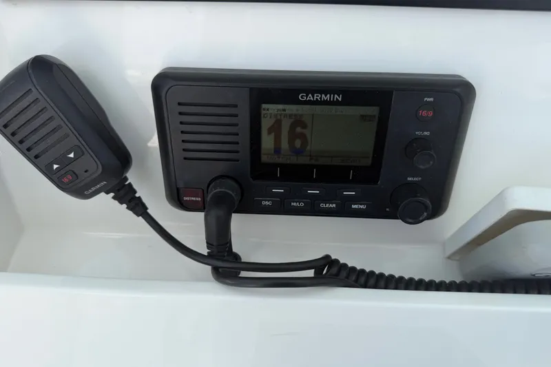 Slide: The Image of Garmin marine radio on 2019 Invincible 36 Open Fisherman boat dashboard. - 53