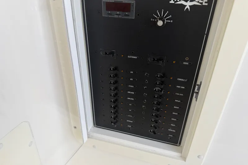 Slide: The Image of Control panel of a 2019 Invincible 36 Open Fisherman boat, featuring various switches and indicators. - 47
