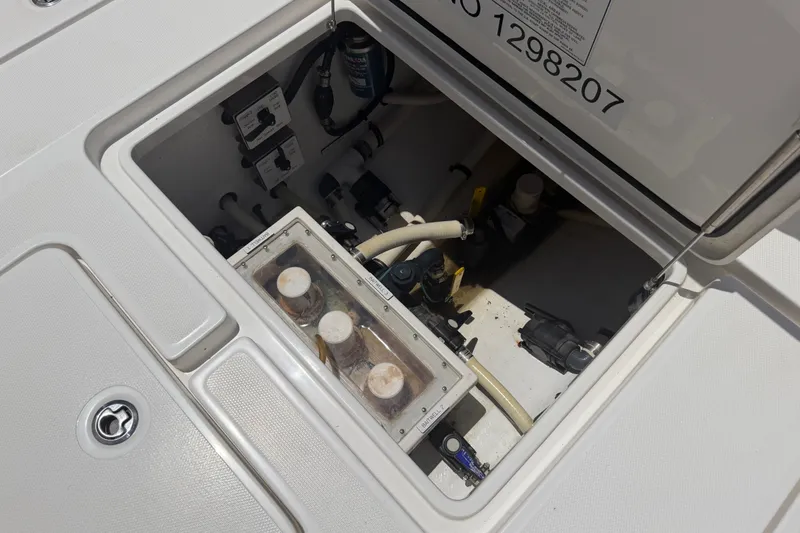 Slide: The Image of 2019 Invincible 36 Open Fisherman boat compartment with visible plumbing and equipment. - 39