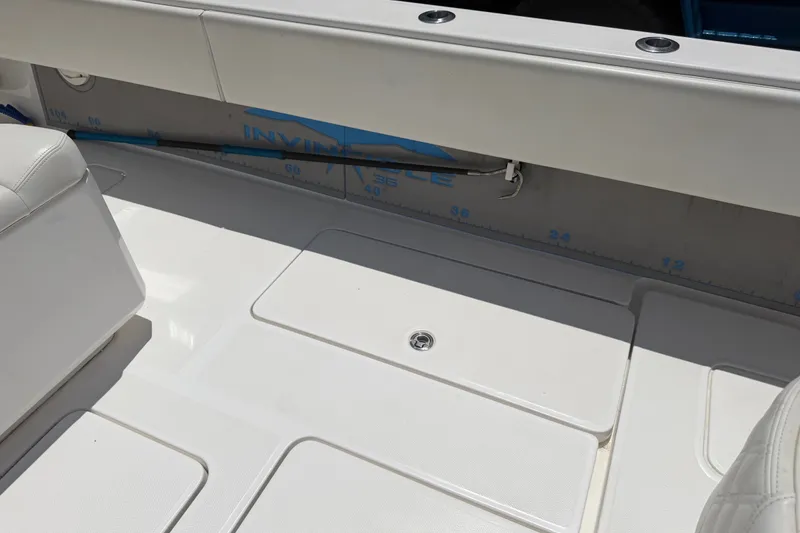 Slide: The Image of 2019 Invincible 36 Open Fisherman boat deck with seating and measurement markings. - 14
