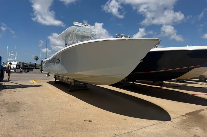 Slide: The Image of 2019 Invincible 36 Open Fisherman boat on trailer under blue sky. - 2