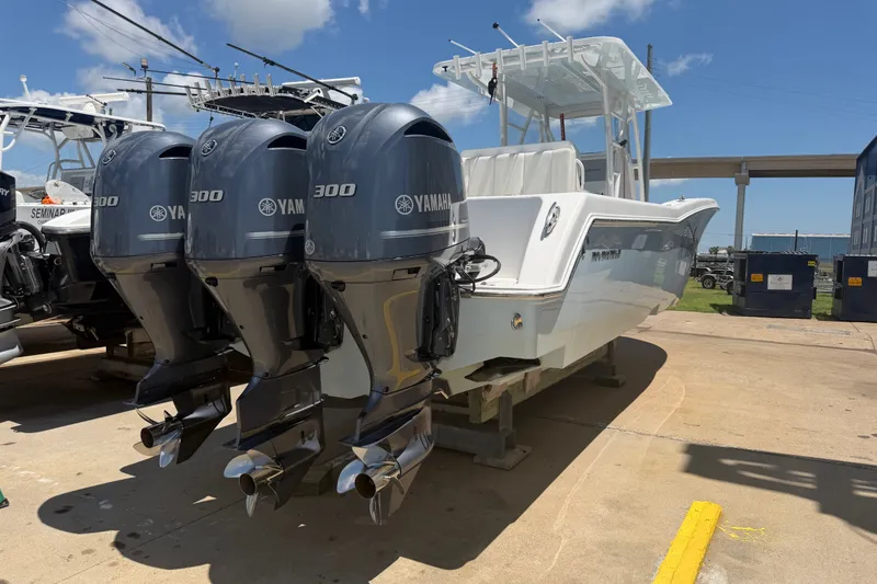Slide: The Image of 2019 Invincible 36 Open Fisherman with triple Yamaha 300 engines on display. - 10