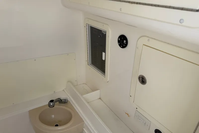 Slide: The Image of Interior of 2019 Invincible 36 Open Fisherman boat with sink and control panel. - 20