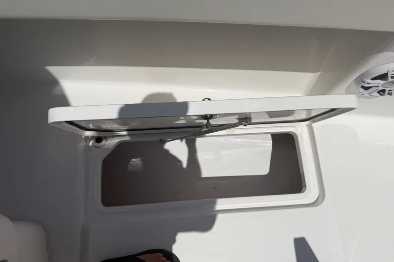 Slide: The Image of Open storage compartment on a 2019 Invincible 36 Open Fisherman boat. - 30