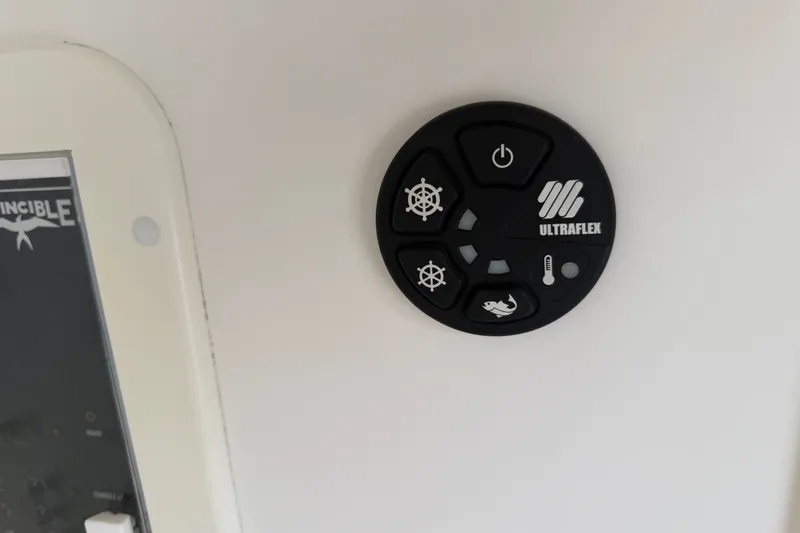 Slide: The Image of Control panel on 2019 Invincible 36 Open Fisherman boat with Ultraflex branding. - 19