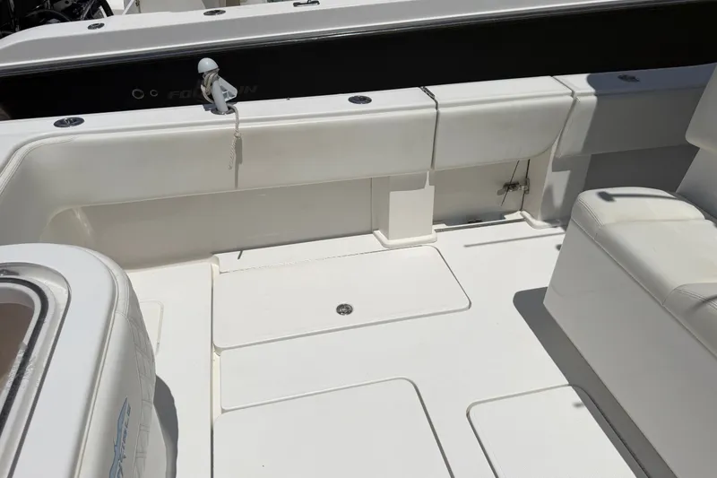 Slide: The Image of 2019 Invincible 36 Open Fisherman boat interior with white seating and deck. - 13