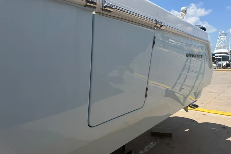 Slide: The Image of 2019 Invincible 36 Open Fisherman boat side view at dock. - 59