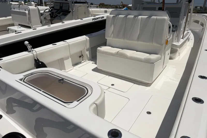 Slide: The Image of 2019 Invincible 36 Open Fisherman boat interior with seating and storage compartments. - 11