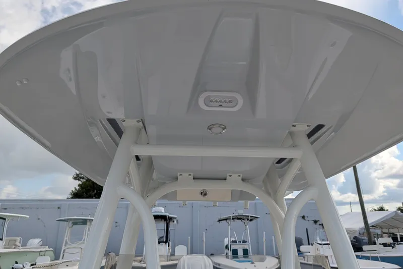Slide: The Image of The image shows the T-top of a 2027 Pathfinder 2600 Hybrid boat. - 35