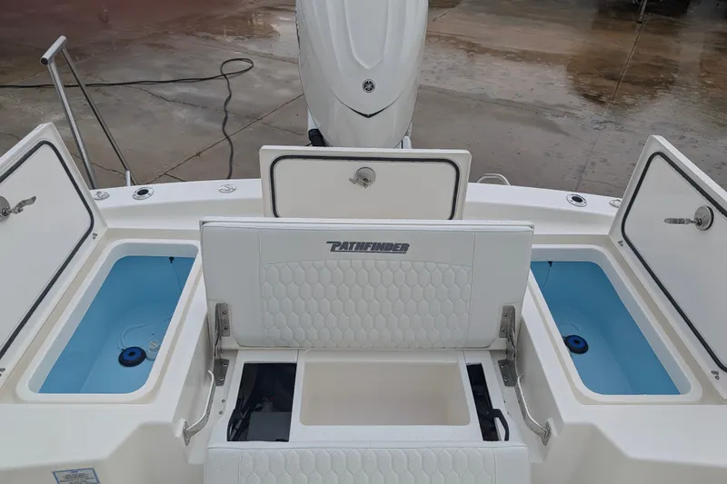 Slide: The Image of 2027 Pathfinder 2600 Hybrid boat with open storage compartments and seating. - 31
