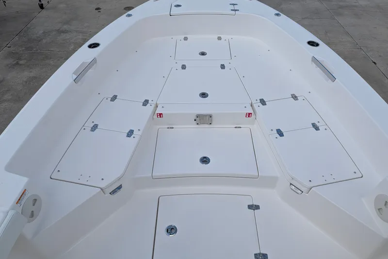Slide: The Image of The image shows the deck of a Pathfinder 2600 Hybrid boat with multiple storage compartments. - 20
