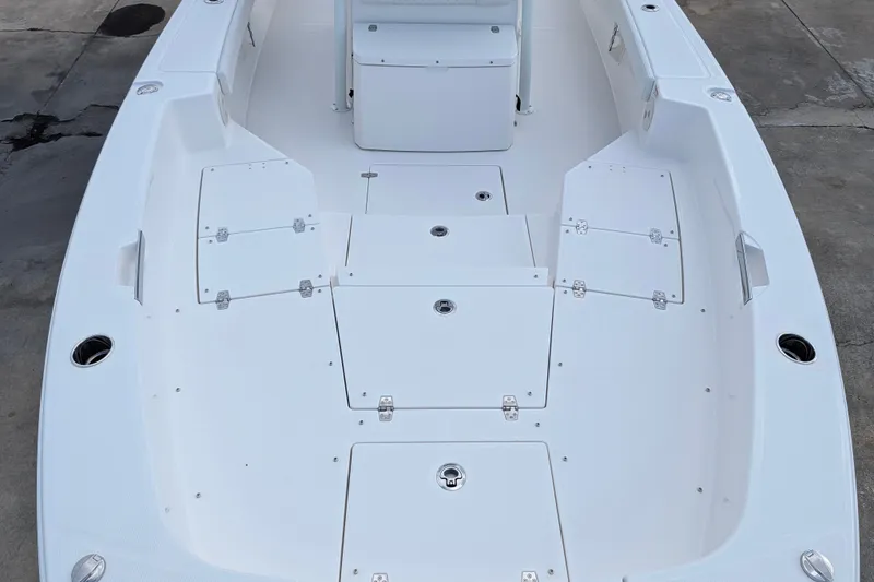 Slide: The Image of The image shows the deck of a 2027 Pathfinder 2600 Hybrid boat with multiple storage compartments. - 23
