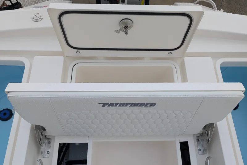 Slide: The Image of 2027 Pathfinder 2600 Hybrid boat interior with storage compartment and branded seating. - 32