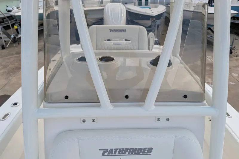 Slide: The Image of The image shows the cockpit of a 2027 Pathfinder 2600 Hybrid boat with clear instrumentation. - 26