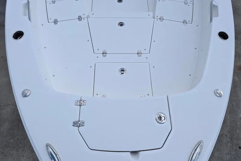 Slide: The Image of The image shows the deck of a Pathfinder 2600 Hybrid boat with multiple storage compartments. - 22