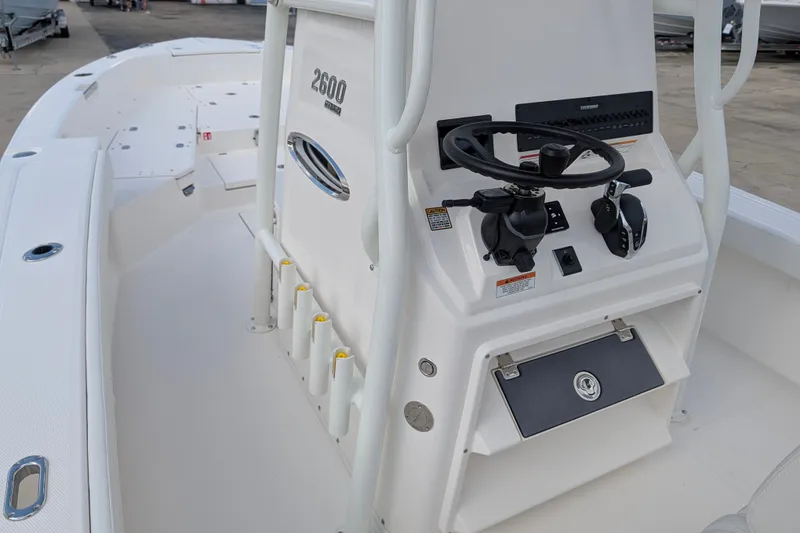 Slide: The Image of The image shows the helm of a Pathfinder 2600 Hybrid boat. It features a modern design. - 13