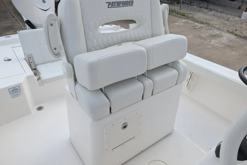 Slide: The Image of The image shows a white seat on a Pathfinder 2600 Hybrid boat. - 18