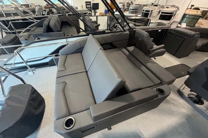 Slide: The Image of Luxurious interior of 2027 Evotti 521CS boat with sleek gray seating and cup holders. - 18