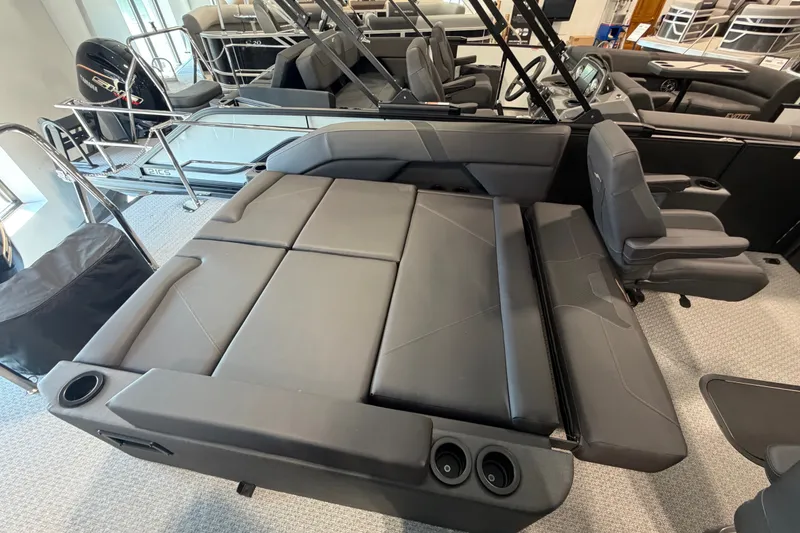 Slide: The Image of 2027 Evotti 521CS boat interior with convertible seating and cup holders. - 15