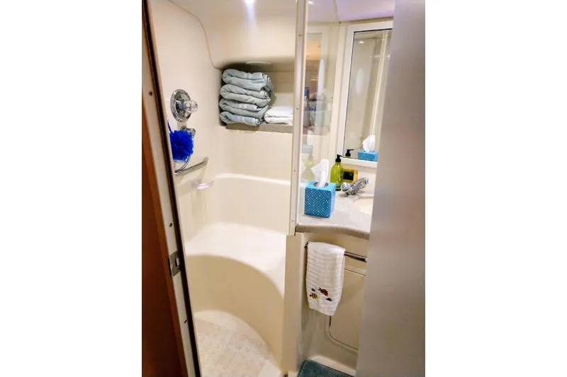 Slide: The Image of Bathroom interior of 1999 Sea Ray Sundancer 400 yacht, featuring shower and vanity area. - 11