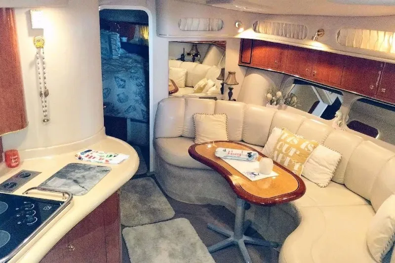 Slide: The Image of Luxurious interior of 1999 Sea Ray Sundancer 400 yacht with cozy seating and kitchenette. - 4