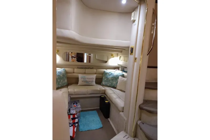 Slide: The Image of Interior of 1999 Sea Ray Sundancer 400 yacht with cozy seating and nautical decor. - 10