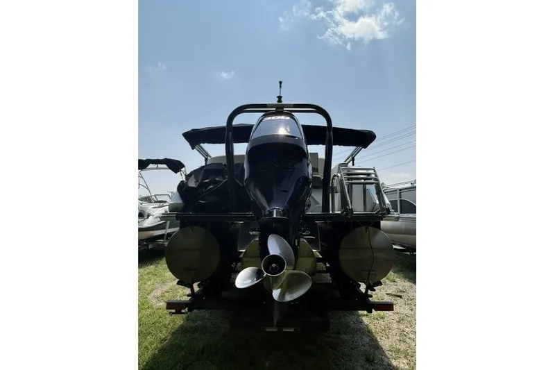 Slide: The Image of 2018 Crest Caribbean 250 SLS pontoon boat, rear view with outboard motor and propeller. - 4