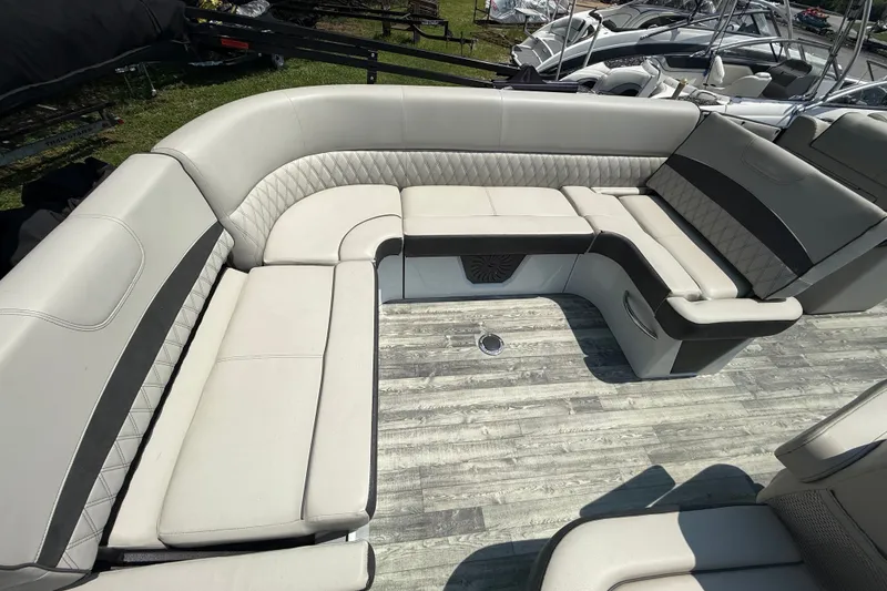 Slide: The Image of Luxurious seating on 2018 Crest Caribbean 250 SLS pontoon boat, featuring elegant upholstery. - 9