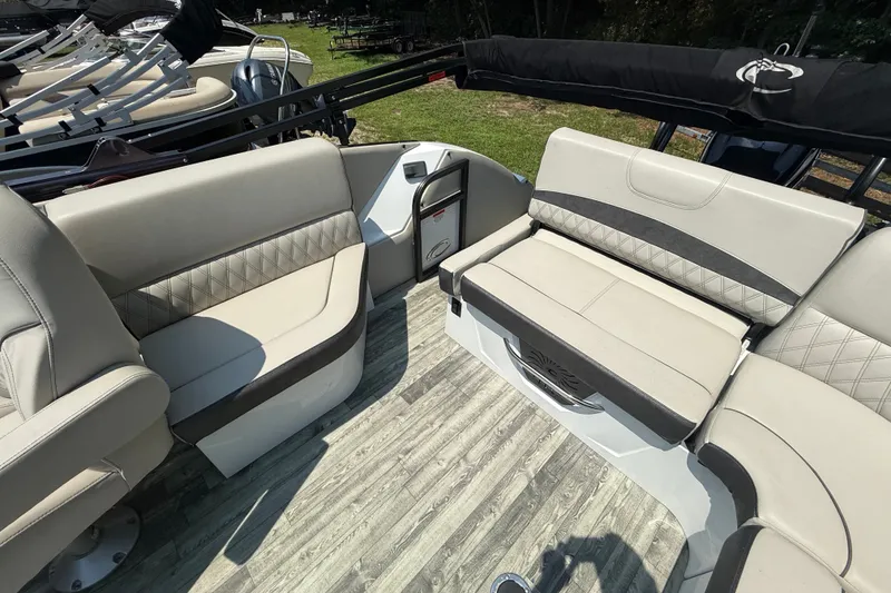 Slide: The Image of Luxurious seating on 2018 Crest Caribbean 250 SLS boat, featuring elegant upholstery and spacious layout. - 7