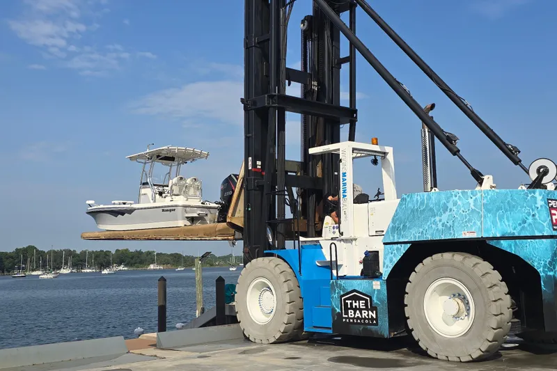 Slide: The Image of 2019 Ranger 2360 Bay Ranger boat lifted by forklift at marina dockside. - 33