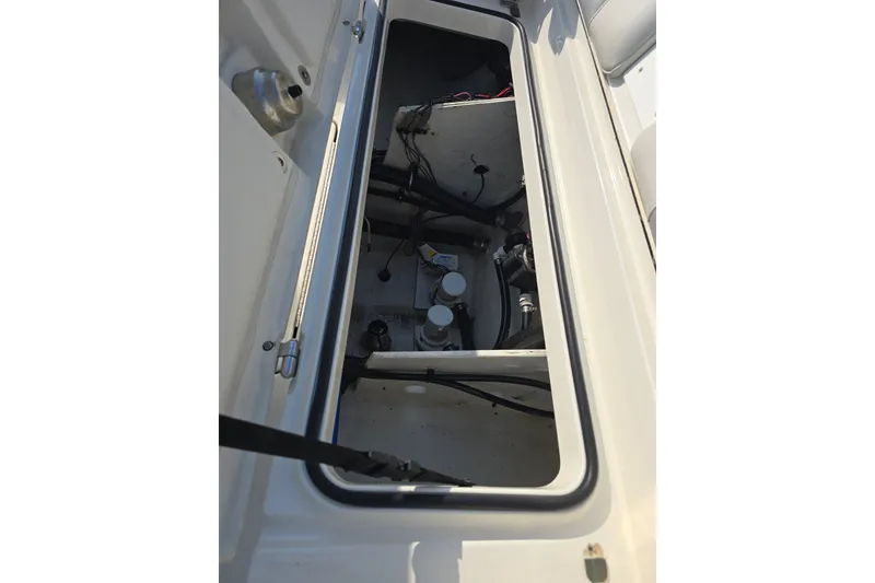Slide: The Image of Open hatch of 2019 Ranger 2360 Bay Ranger boat showing internal components. - 25